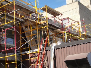 Scaffolding alongside building in preparation for masonry restoration project