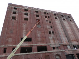 Commercial masonry contractors restoring the eight story Fairmont Creamery building.